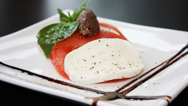 Fresh Mozarella and Vine Ripened Tomatoes with Three Olive Tapanade, drizzled with balsamic glaze